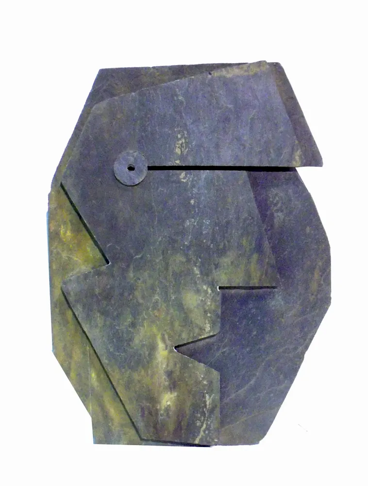 Artwork titled "Cabeza negra-13" made with slate stone in the year 1991 by Juan Diego Miguel