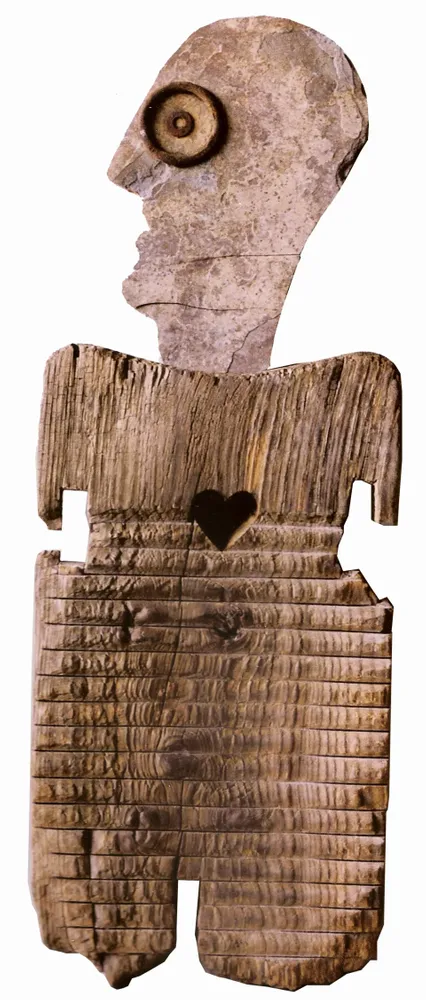 Artwork titled "Personaje-tabla" made with iron, limestone, wood in the year 1992 by Juan Diego Miguel