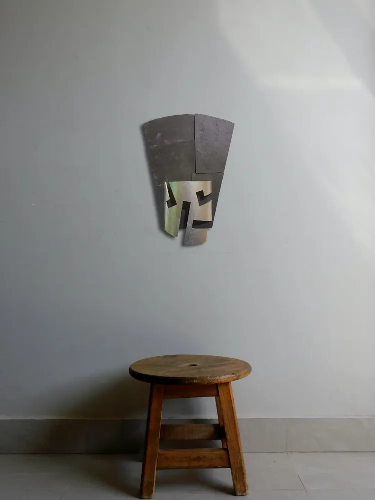 Artwork titled "Careta-gorro" made with synthetic enamelled paint, plastic, slate stone in the year 2022 by Juan Diego Miguel