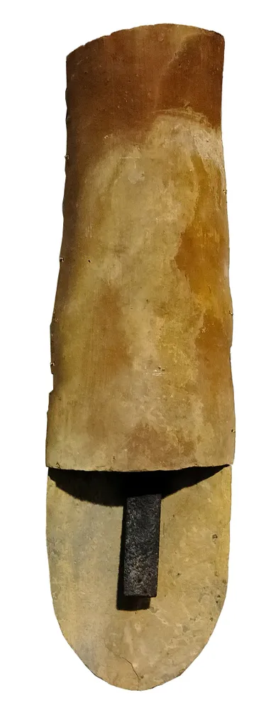 Artwork titled "Cabeza tocada" made with limestone, iron, ceramic, brass in the year 2023 by Juan Diego Miguel