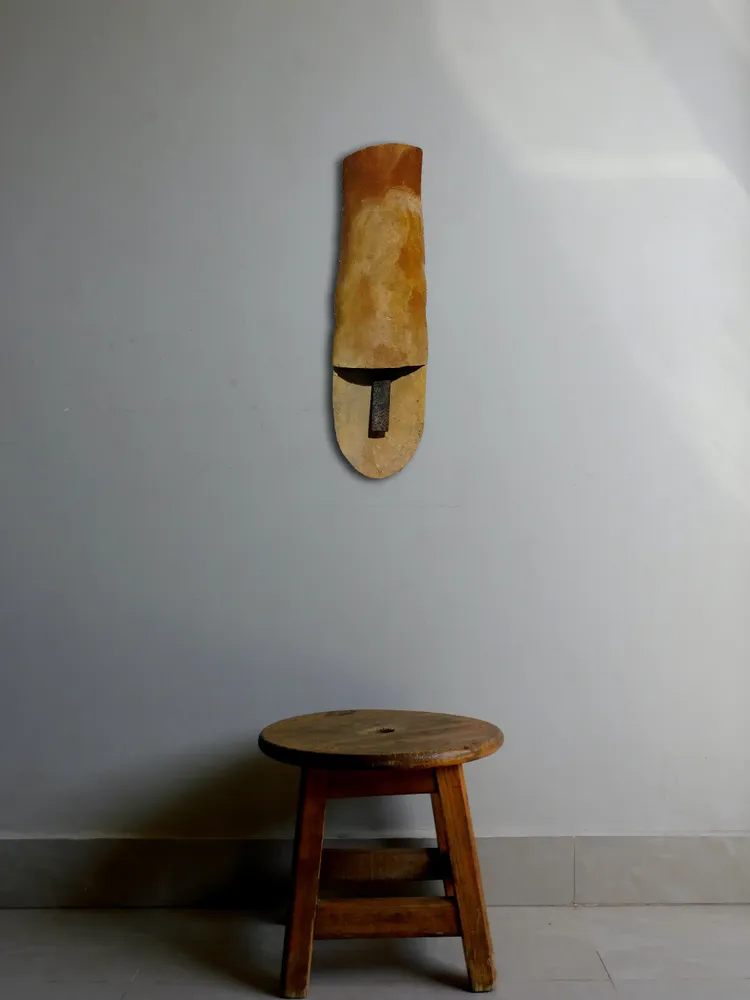 Artwork titled "Cabeza tocada" made with limestone, iron, ceramic, brass in the year 2023 by Juan Diego Miguel