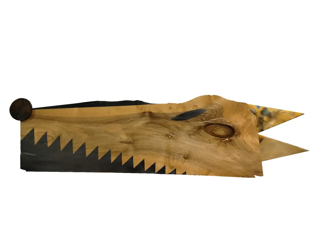 Artwork titled "Perro" made with rubber, iron, wood, graphite, brass in the year 2024 by Juan Diego Miguel